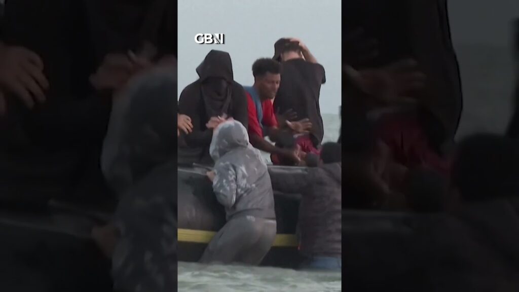 Migrant boat FULL OF MEN sets sail for Britain from French beach