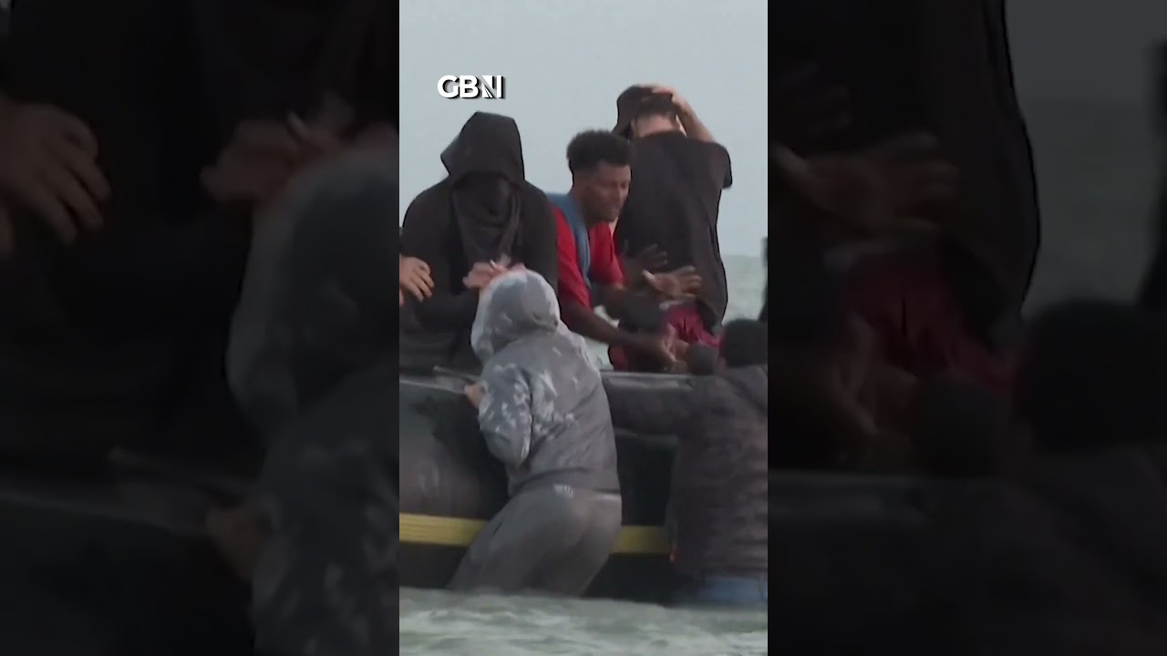Migrant boat FULL OF MEN sets sail for Britain from French beach